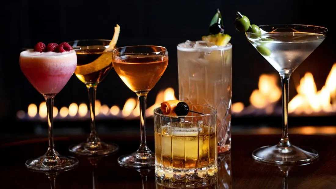 A selection of Street Bar cocktails photographed beside a fireplace