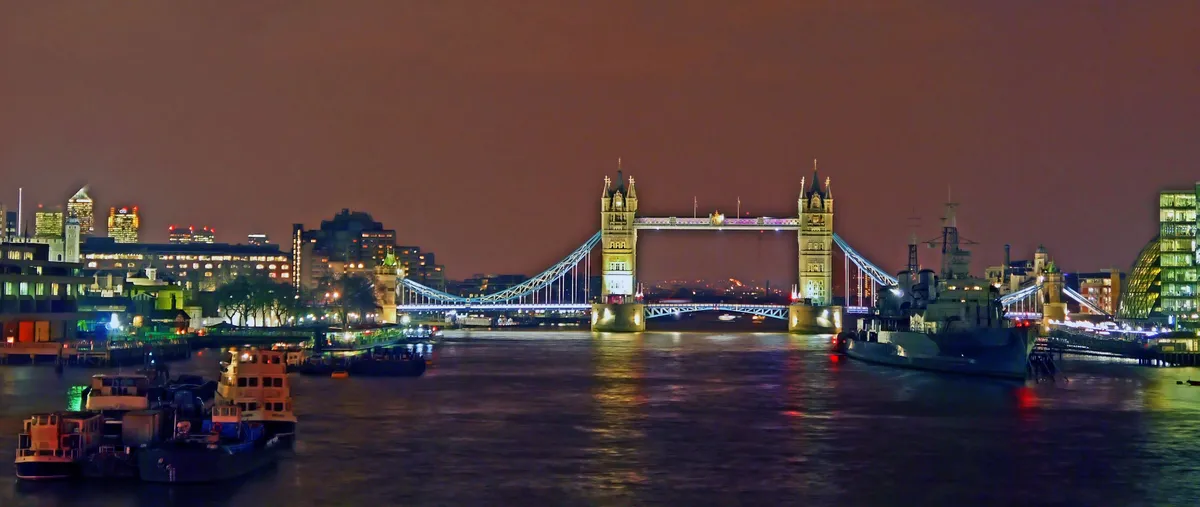 Tower Bridge illuminated over the Thames at dusk