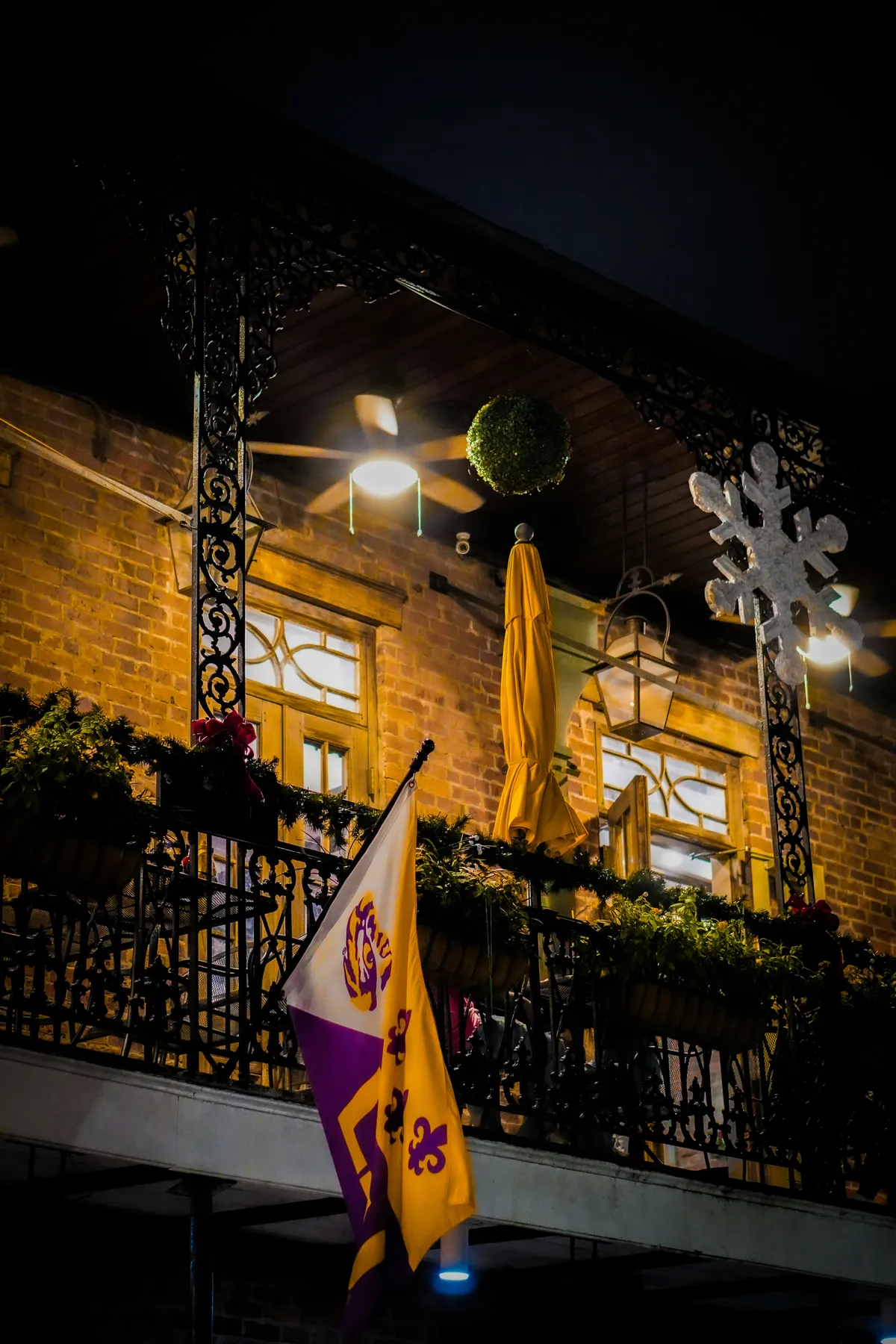 A glowing balcony at night in New Orleans